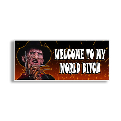 A rectangular horror-themed banner or sign featuring a stylized depiction of Freddy Krueger on the left and the text 'WELCOME TO MY WORLD BITCH' in large white letters on the right, set against a fiery orange and black background.